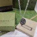 Gucci GG Engraved Medallion Pendant Necklace