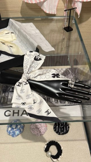Chanel Double-Sided Bow Hair Tie with Heart and Four-Leaf Clover Motifs
