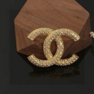 CHANEL Adrienne Radiant Emblem Brooch