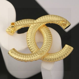 CHANEL Adrienne Radiant Emblem Brooch
