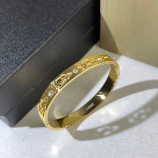 YSL Dual Tone Crystal Emblem Cuff Bracelet