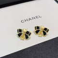 Chanel Camellia black bow stud earrings