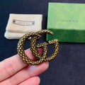 Gucci GG Interlocking Textured Gold Brooch